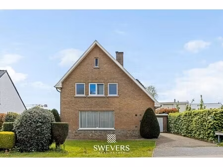 open bebouwing met minimum vier slaapkamers te zonhoven