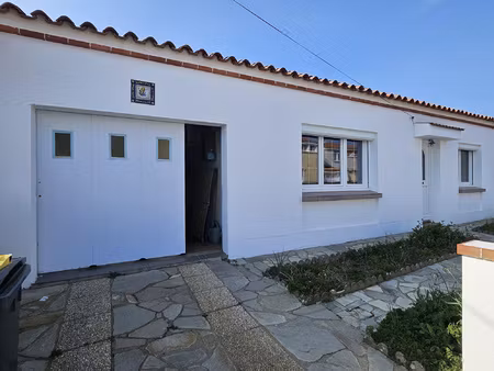 maison de plain-pied de 100 m2 avec garage et jardin fort