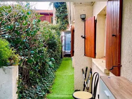 maison t3 avec belle terrasse verdoyante de 27 m2 et place de parking dans garage