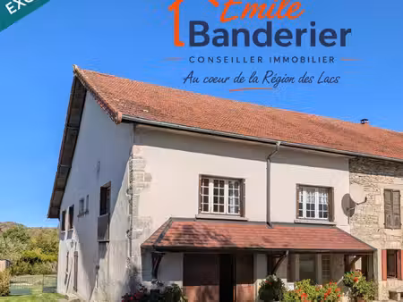 maison de village de 134 m² avec garages et terrain en pays des lacs