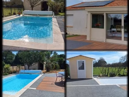 maison individuelle piscine panneaux solaire cheminée climatisation