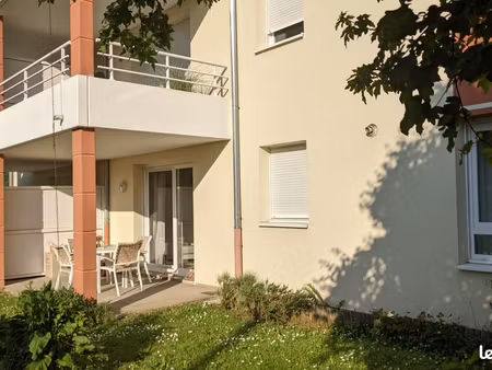 f2 en rez-de- jardin (54 m²) avec garage