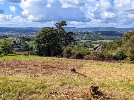 terrain 1040 m2 voutezac avec vue