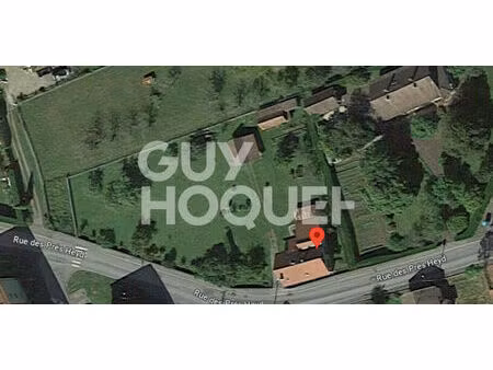 grand terrain plat de 12ares 91ca