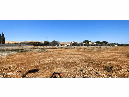 proximité narbonne et canal du midi  terrain viabilisé de 405 m2  ginestas