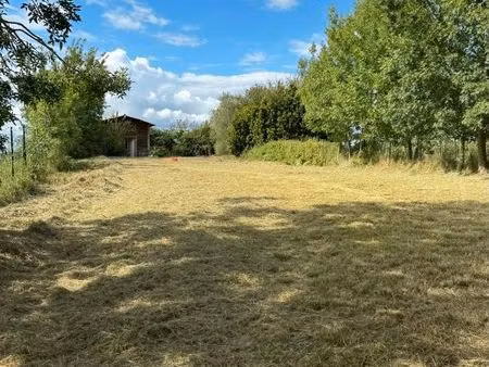 terrain viabilisé à pouy de touges avec bâtisse