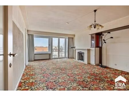 appartement spacieux à rénover au cœur de la rue commerçante