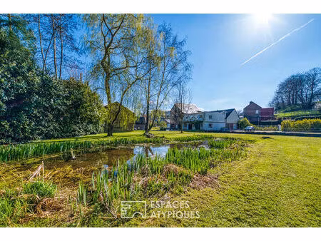 ancien moulin à eau devenu ensemble immobilier avec jardin et dépendance