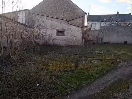 terrain à bâtir avec batiment