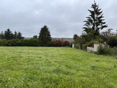 beau terrain à bâtir plat et orenté sud avec façade de 33m