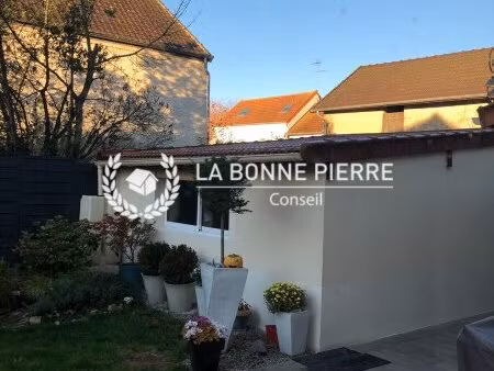 maison de 198 m2 louée et garage à tranformer