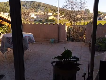 immeuble comprenant deux appartements avec terrasses   garage  jardin