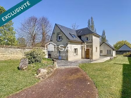 maison familiale avec grands espaces de vie  dépendances et garage.