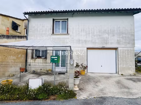 maison de 105m2 avec 3 chambres  un garage et un petit jardi