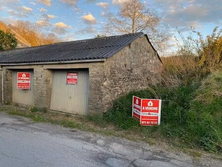 __ vendu __ double garage avec partie jardin et passage lat