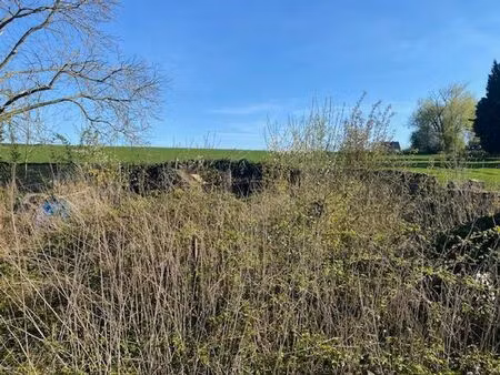 __ vendu __ double garage avec partie jardin et passage lat