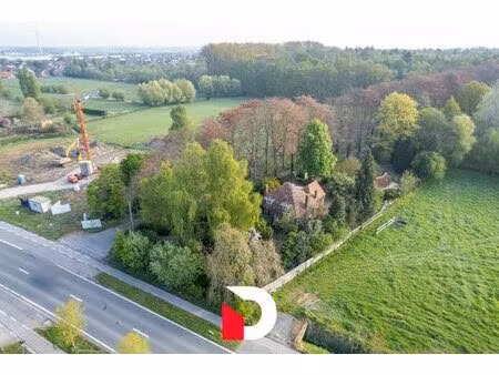 uniek perceel van 6.448 m² met te renoveren woonst aan merkenveld bos te zedelgem