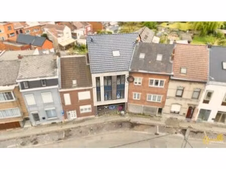 immeuble de rapport (2 app à parachever + parkings & hangar)