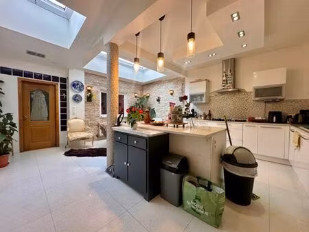 rez de chaussée 1 logement +1 atelier réunis !!