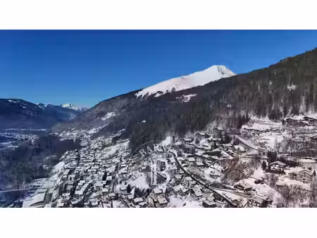 morzine - terrain constructible de 1472 m² - route d'avoriaz - exposé sud-ouest