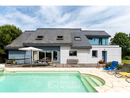 maison québécoise en ossature bois avec piscine