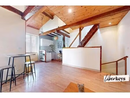 immeuble comprenant deux habitations et un commerce