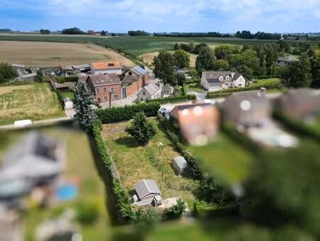 beau terrain à vendre dans le village de baulers !