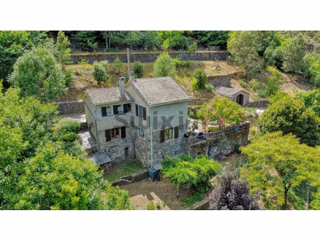 maison en pierres avec terrain terrasse  rivière  garage et