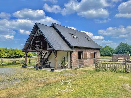 maison en briques edifiee sur 1.5ha avec box et herbages