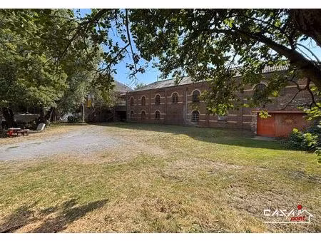 terrain à bâtir avec bâtiment industriel existant !