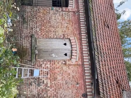 terrain avec bâtisse