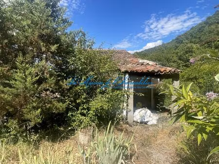 proche saint-ambroix maison mitoyenne en pierre avec 2 chambres plus bureau et jardin de..