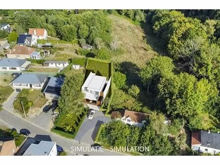 terrain à bâtir de 10 are pour 4-façades