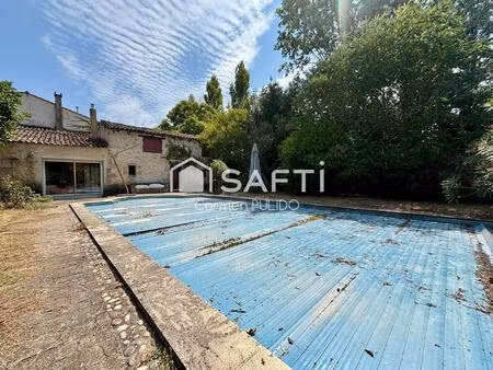 ancien presbytère de charme en pierre avec studio  dépendances  grand jardin et piscine  à