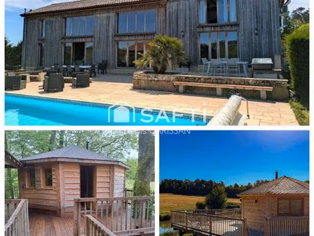 propriété à vocation touristique  sur 10ha de bois  prairies et étang...