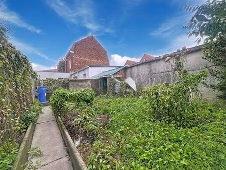 terrain constructile - 4 garages - secteur coeur de ville - niep