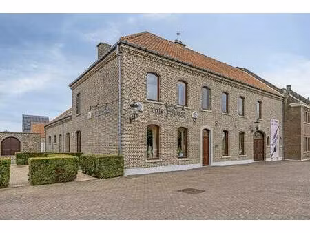 handelshuis met café en feestzaal + bouwgrond te koop in tongerlo