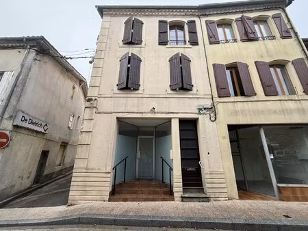 immeuble de rapport locatif composé d'un local commercial et plusieurs appartements à réno