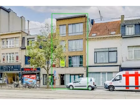 vergund appartementsgebouw met 3 appt  handelsglvl en tuin in merksem!