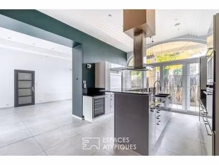 appartement en rez-de-chaussée avec terrasse  stationnement et garage