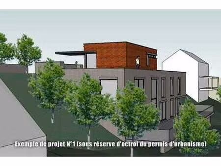 terrain de 10 ares dans un cadre boisé  à 5 minutes de lln