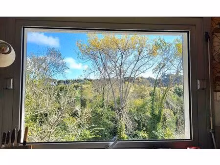 maison des années 70 dans un cadre verdoyant  3 chambres  garage et accès à la plage à...