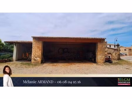 combas – hangar avec carport au cœur du village