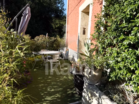 a combovin  belle et grande maison