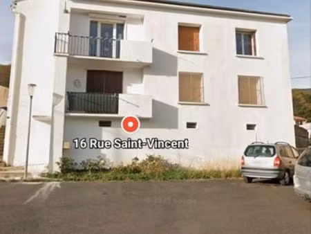 immeuble avec petit terrain