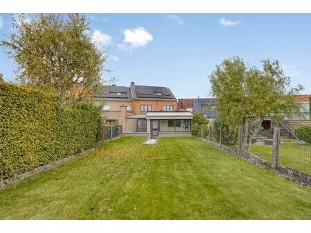 ruime woning met zuidoostgerichte tuin in merchtem