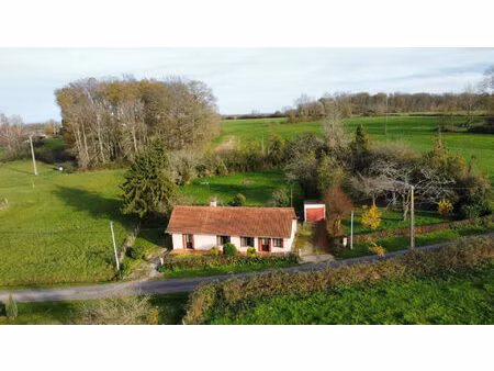 charmante maison de plain-pied sur grand terrain arboré de 2000 m²  à 8 minutes des arcade