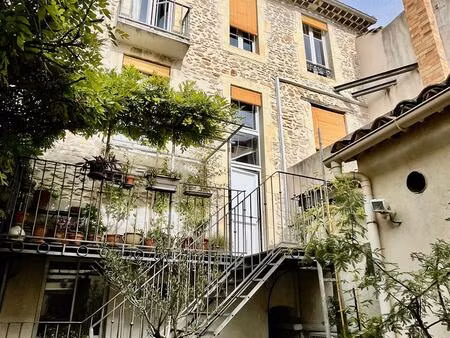 immeuble à forte rentabilité composé de 2 logements  un local  un garage et un espace...