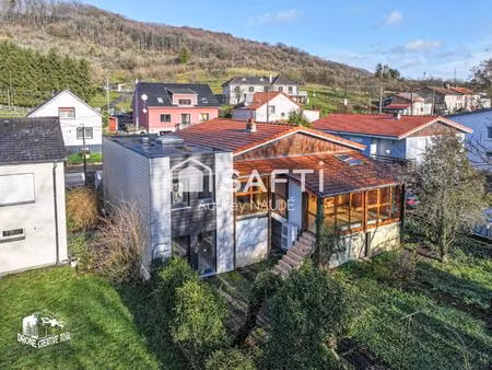 maison familiale lumineuse avec jardin et véranda