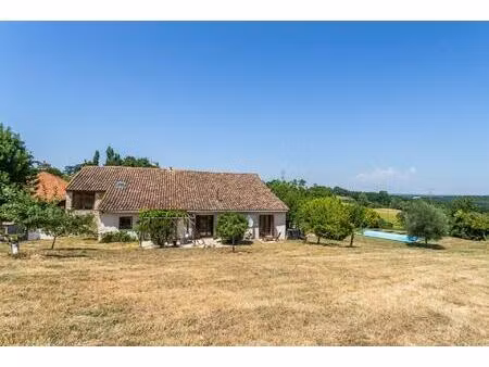 stone property with pool on the edge of a village